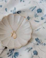 Gold Blessings Necklace in a jewelry dish product photo