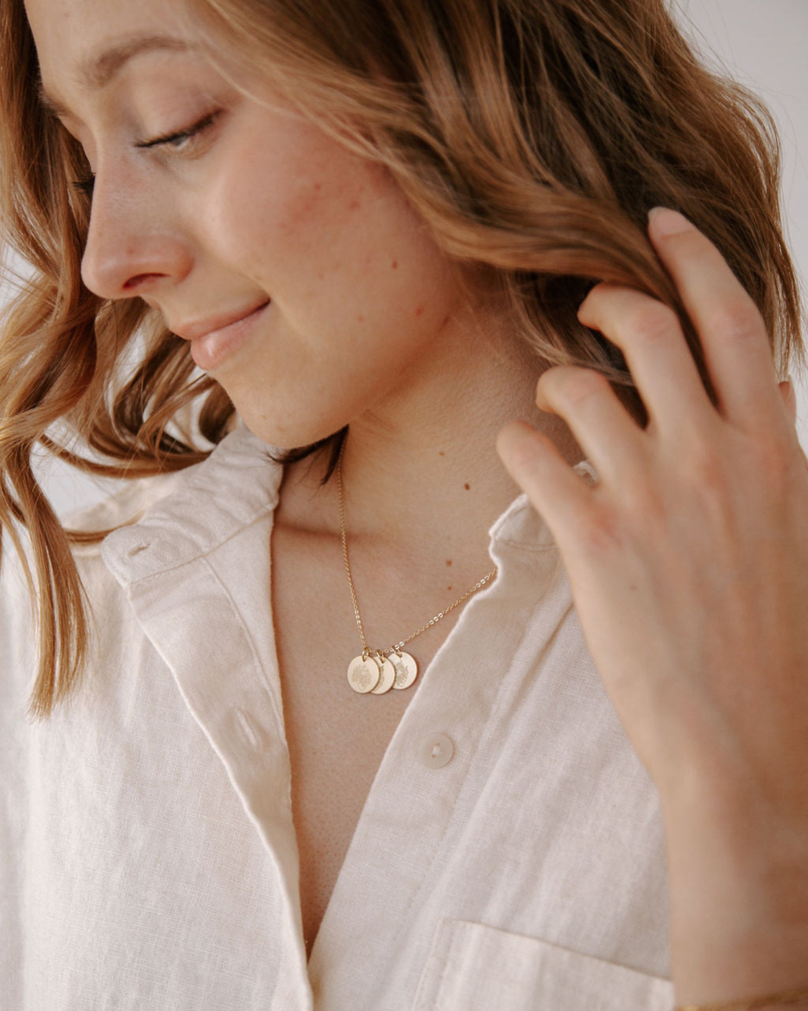 Gold Heavenly Hearts Necklace styled on a woman