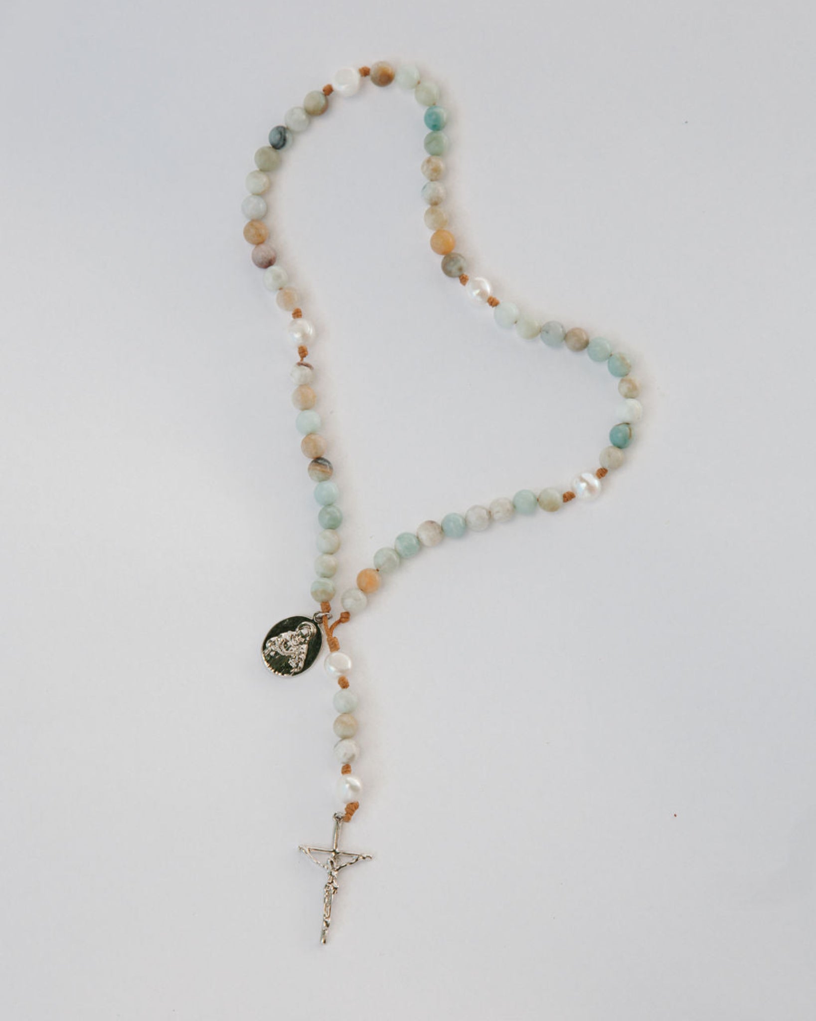 sea of galilee rosary with gemstone beads on white background