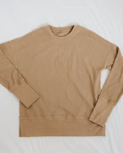 Beige long-sleeve shirt on a white background