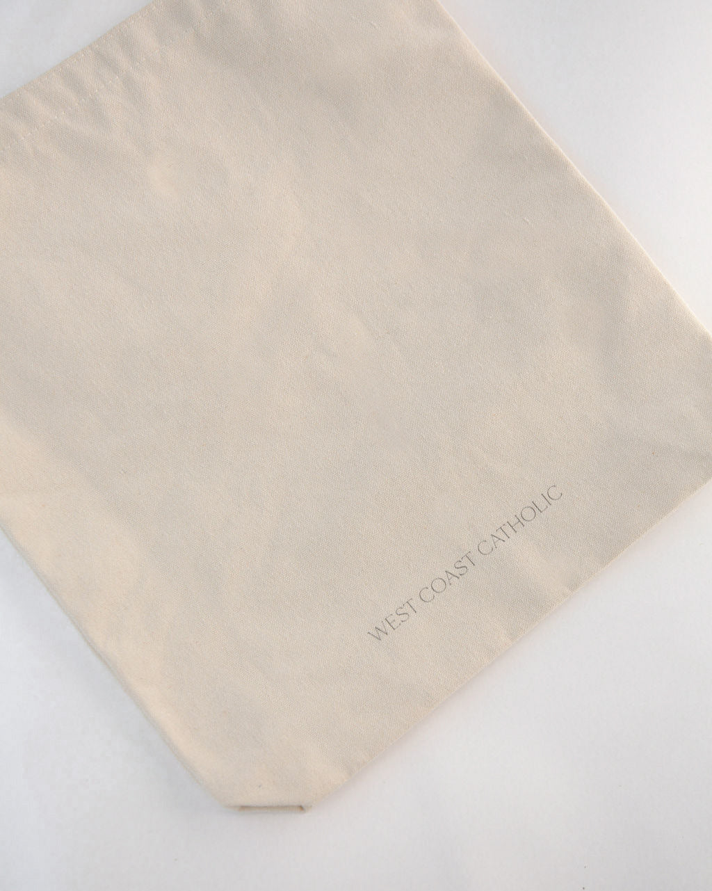 Beige fabric with 'West Coast Linens' branding on a white background