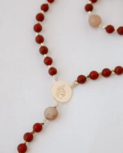 Rosary with red beads and gold details