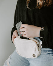 Cream Marian Belt Bag Styled On Woman and Showing Functional Use