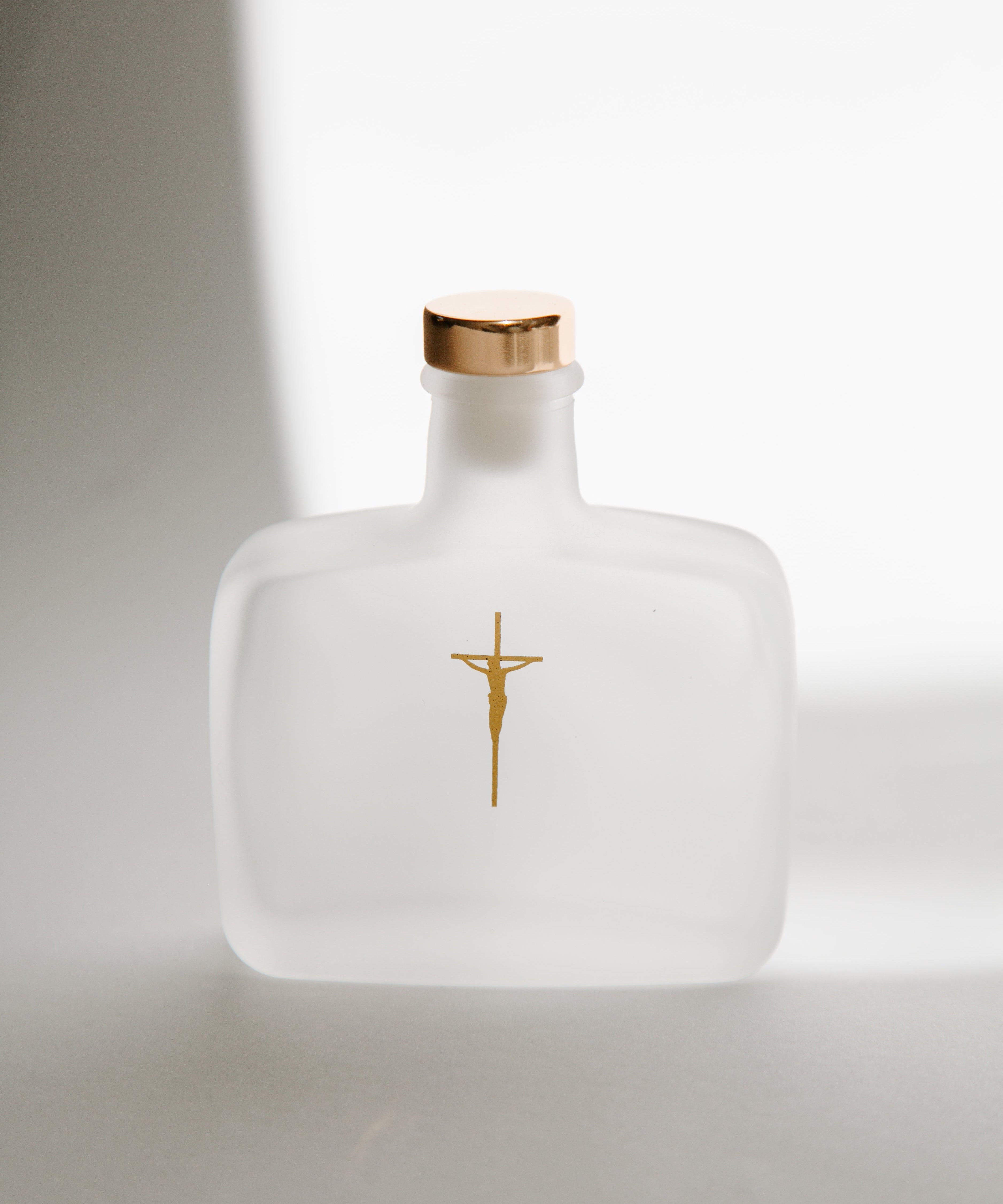 The Symbols of Baptism Explained: Holy Water, Baptismal Candle, Chrism Oil, and Wearing White
