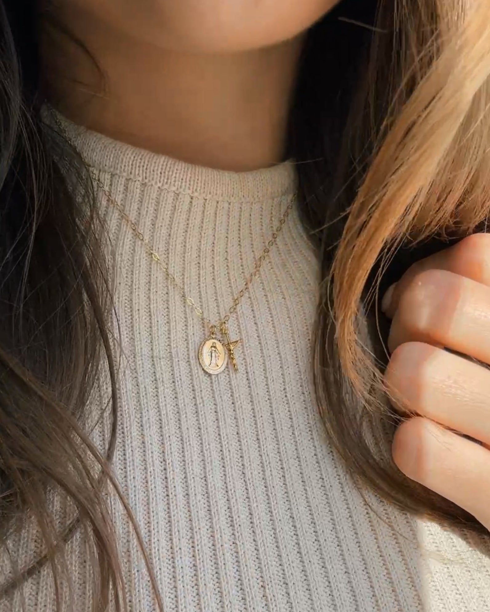 Gold Blessings Necklace worn on a woman's neck 