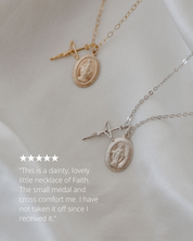 Two necklaces with medallions and crosses on a light background review