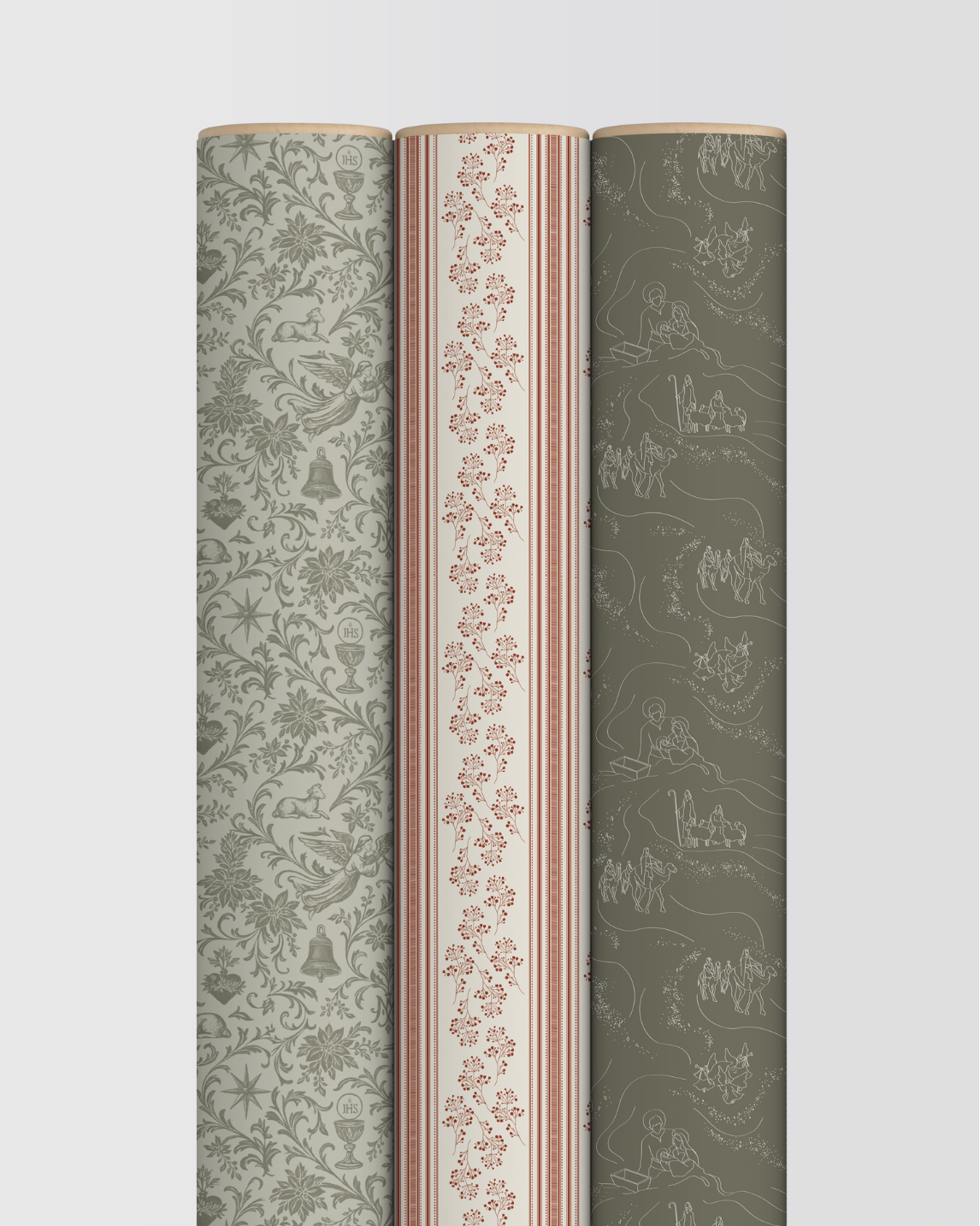 Three rolls of patterned wallpaper on a light gray background