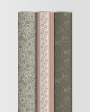 Three rolls of patterned wallpaper on a light gray background