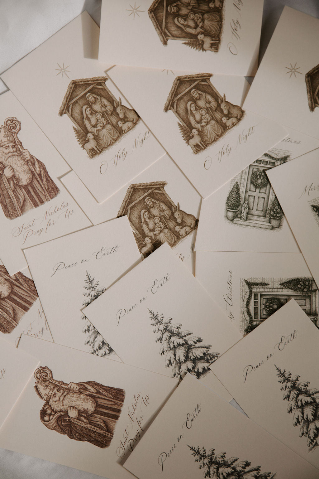 Collection of vintage-style cards with religious illustrations and text.