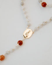 Rosary with white and orange beads with gold medal