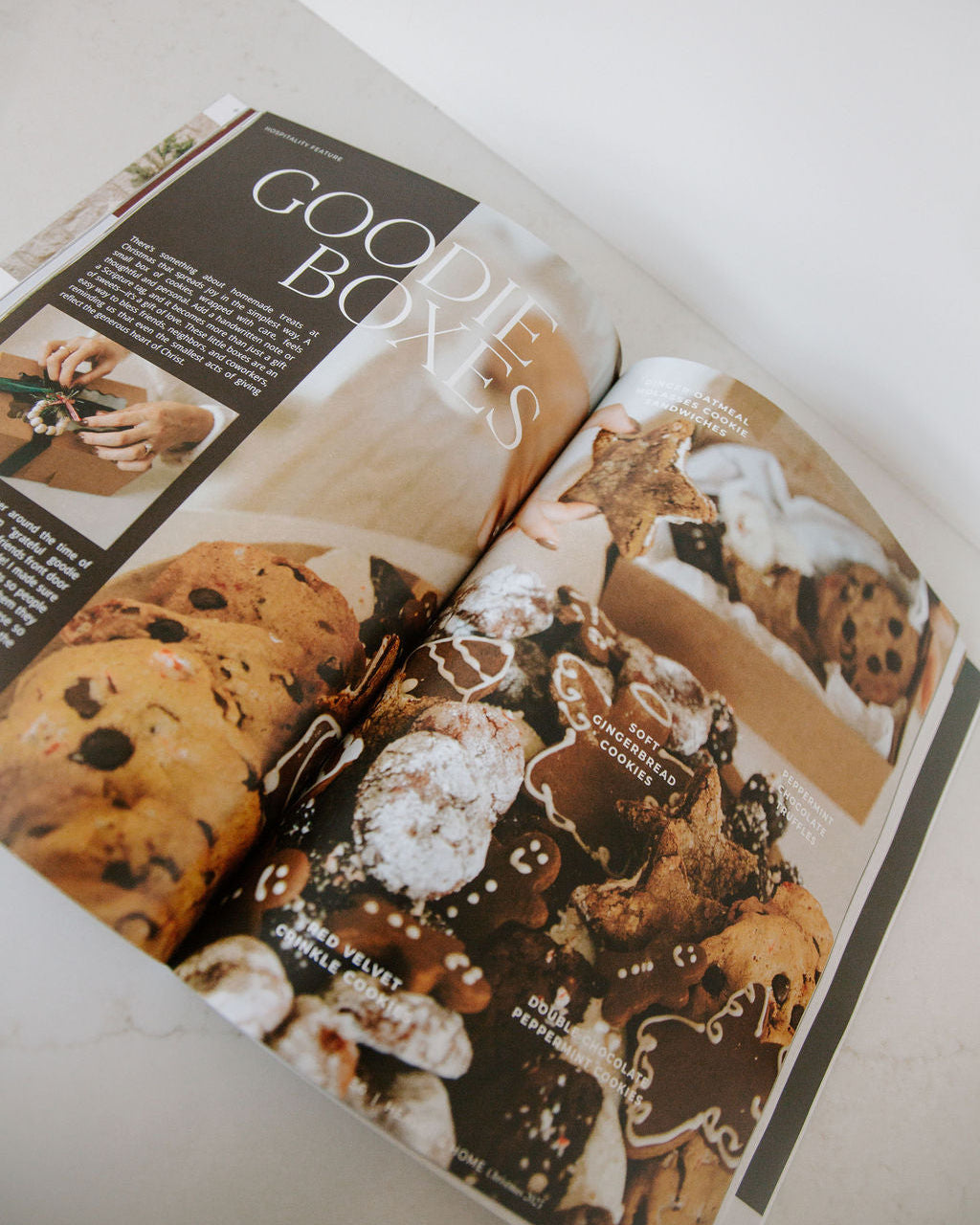 Open magazine or book showing images of cookies and text about 'Goodies Box'.