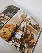 Open magazine or book showing images of cookies and text about 'Goodies Box'.