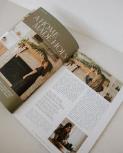 Open book with a chapter titled 'A Home Made Holy' on a white background