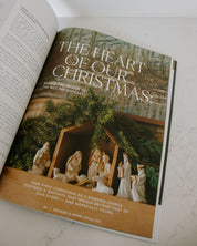 Open book with a Christmas-themed page featuring a nativity scene.