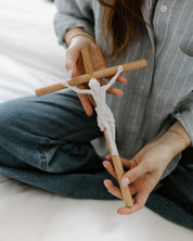 Modern wall crucifix held in woman's hands