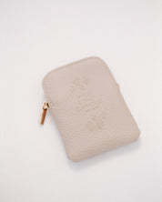 Beige leather rosary pouch with embossed logo on a white background