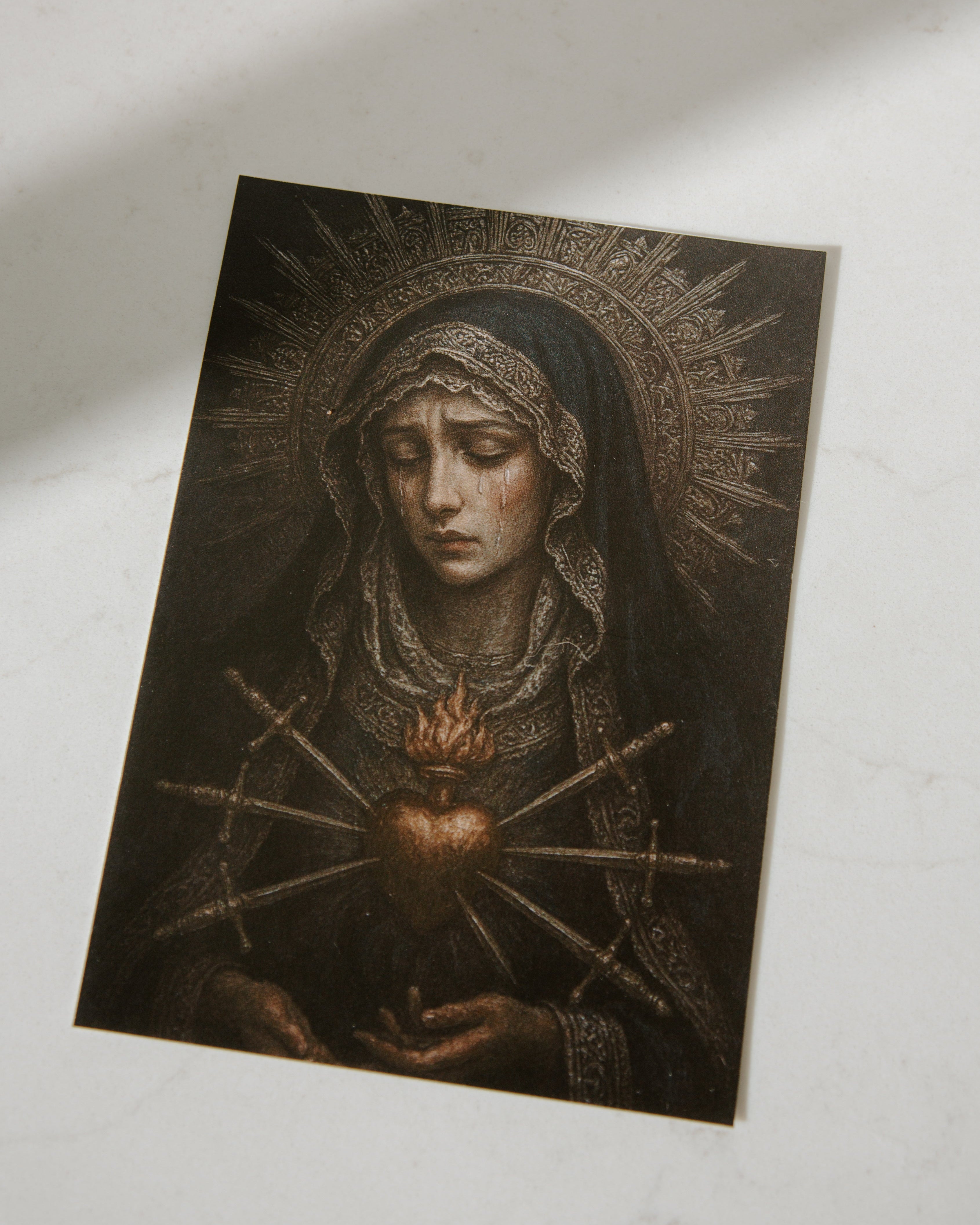 Artistic depiction of our lady of sorrows with a halo on a textured surface