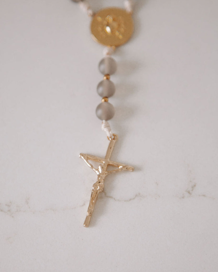 Gold crucifix on a white background