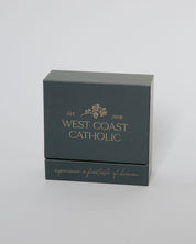 Dark gray box with 'West Coast Catholic' branding on a light gray background