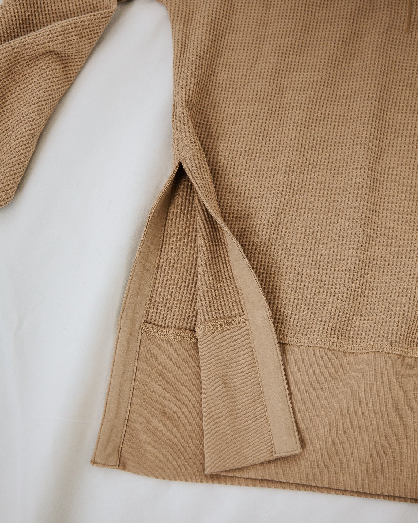 Brown textured garment on a white background