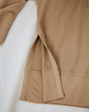 Brown textured garment on a white background