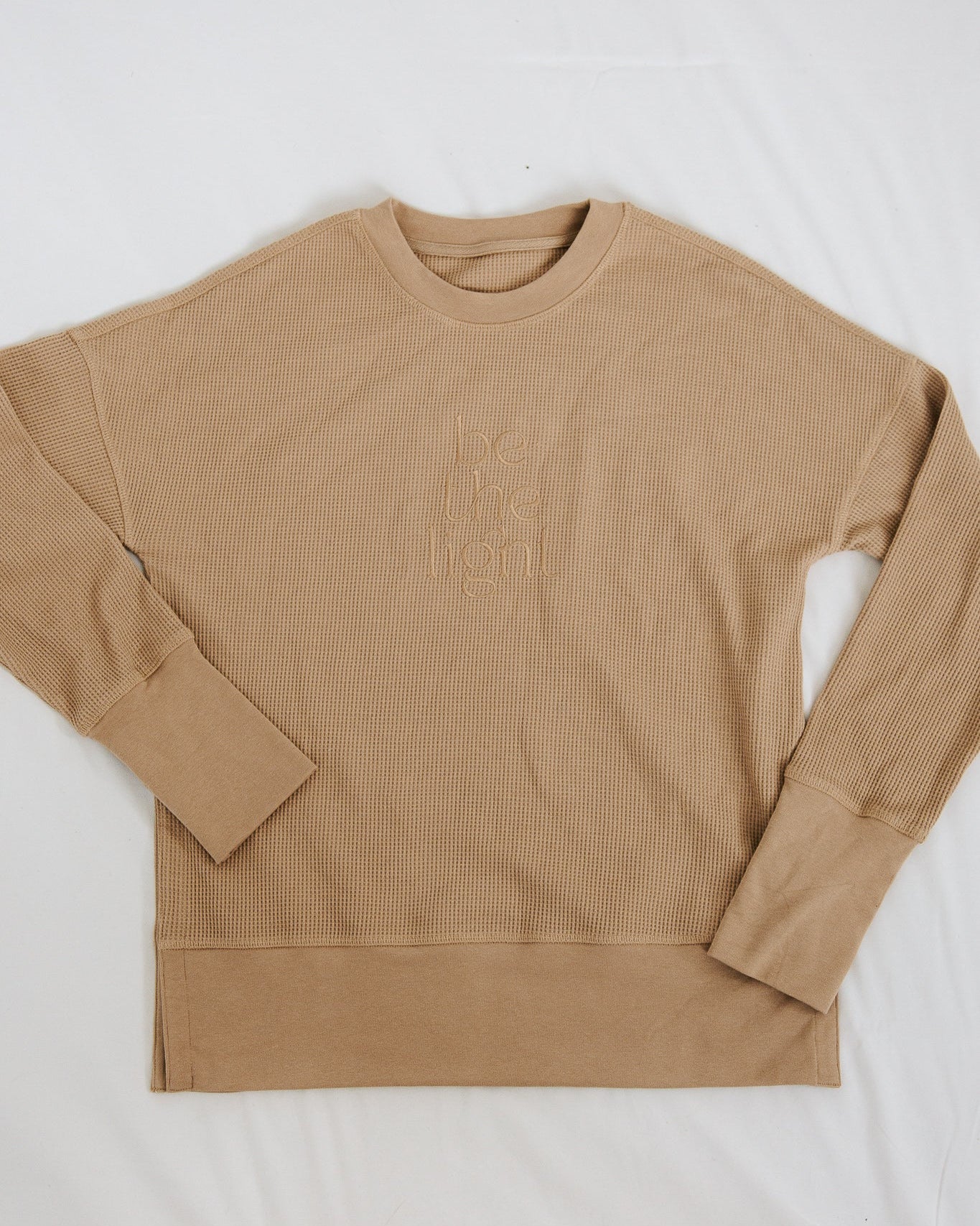 Beige long-sleeve shirt on a white background