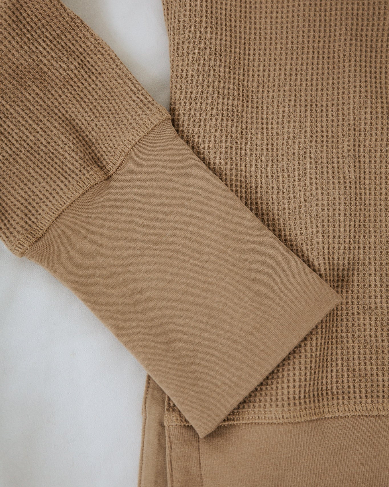 Close-up of a brown textured garment on a white background