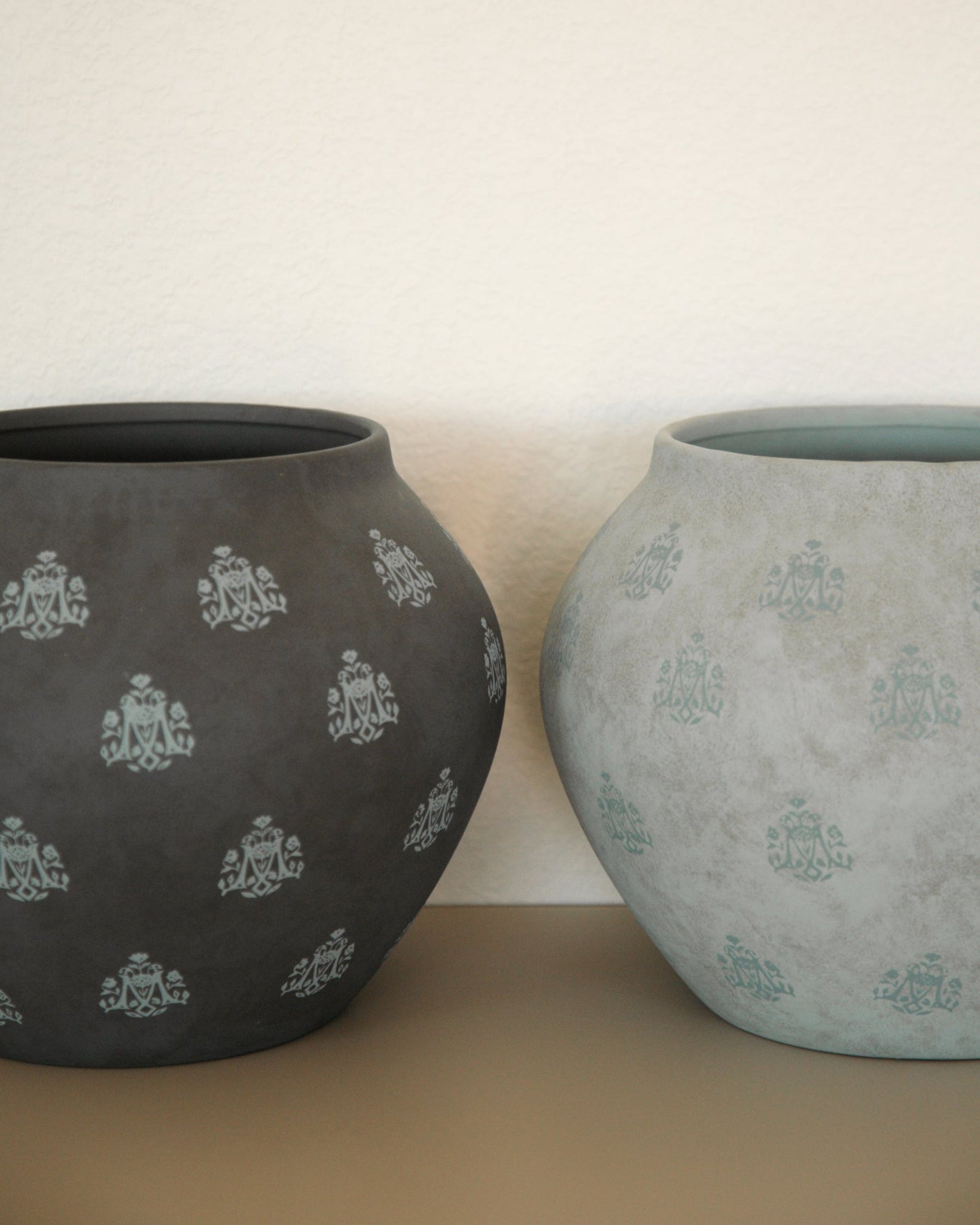 Two West Coast Catholic original Marian Vases. Designed with a repeating Marian "M" symbol in a light blue color. 
