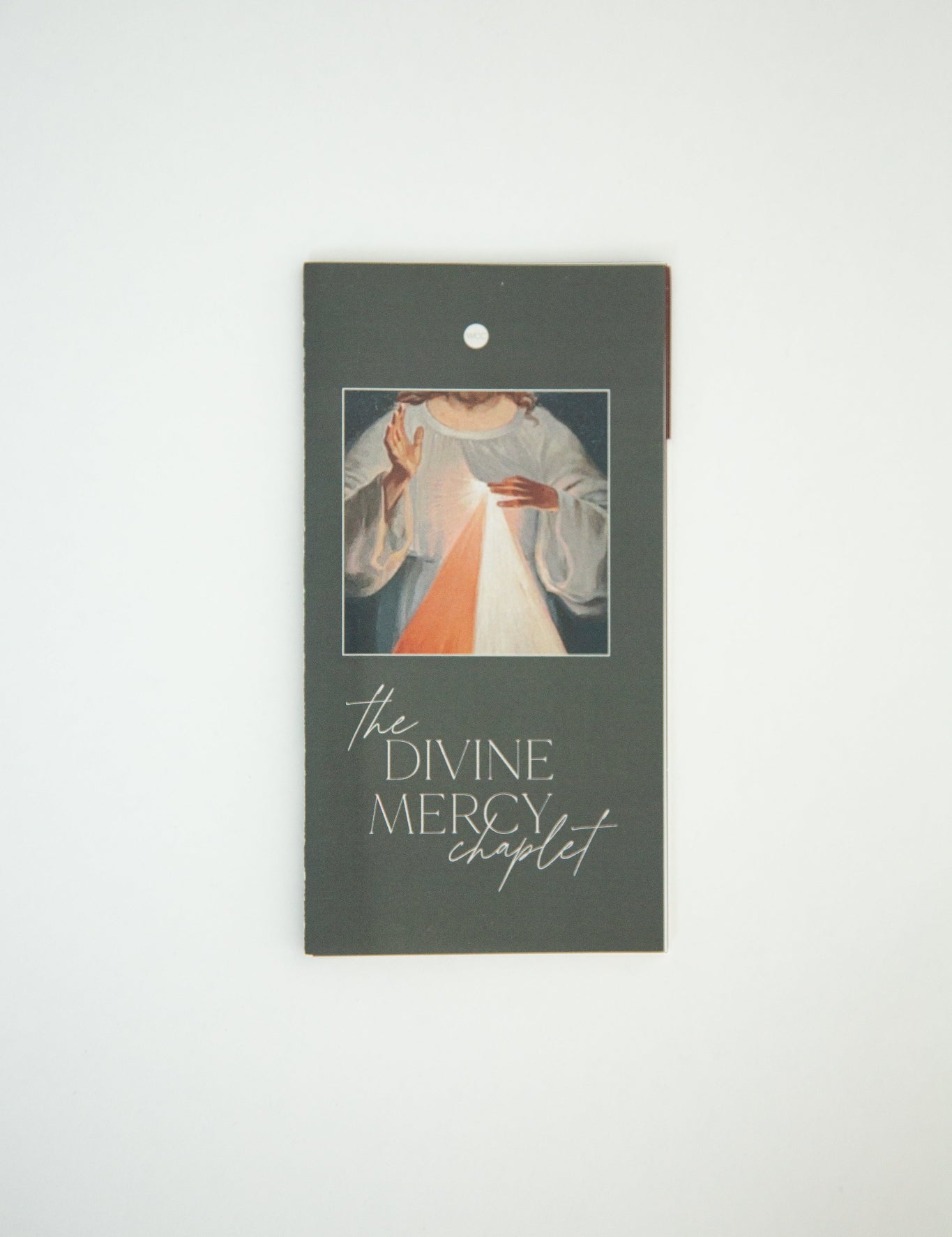 A Divine Mercy Chaplet booklet with a gray cover, featuring an image of a rosary and text.