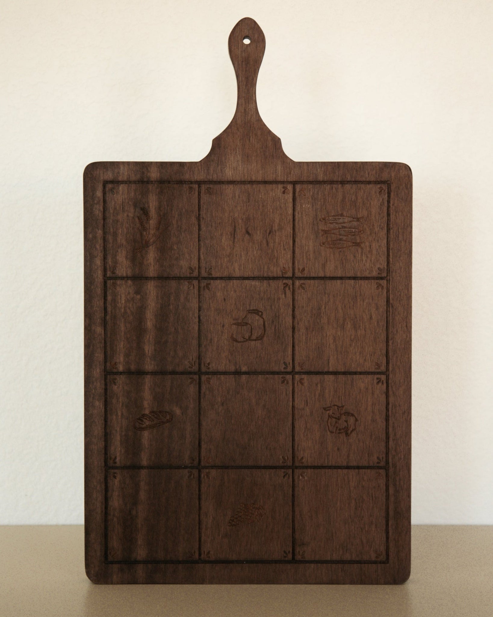 Rectangular mango wood Catholic serving board with a handle, engraved with six Gospel symbols.