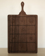 Rectangular mango wood Catholic serving board with a handle, engraved with six Gospel symbols.