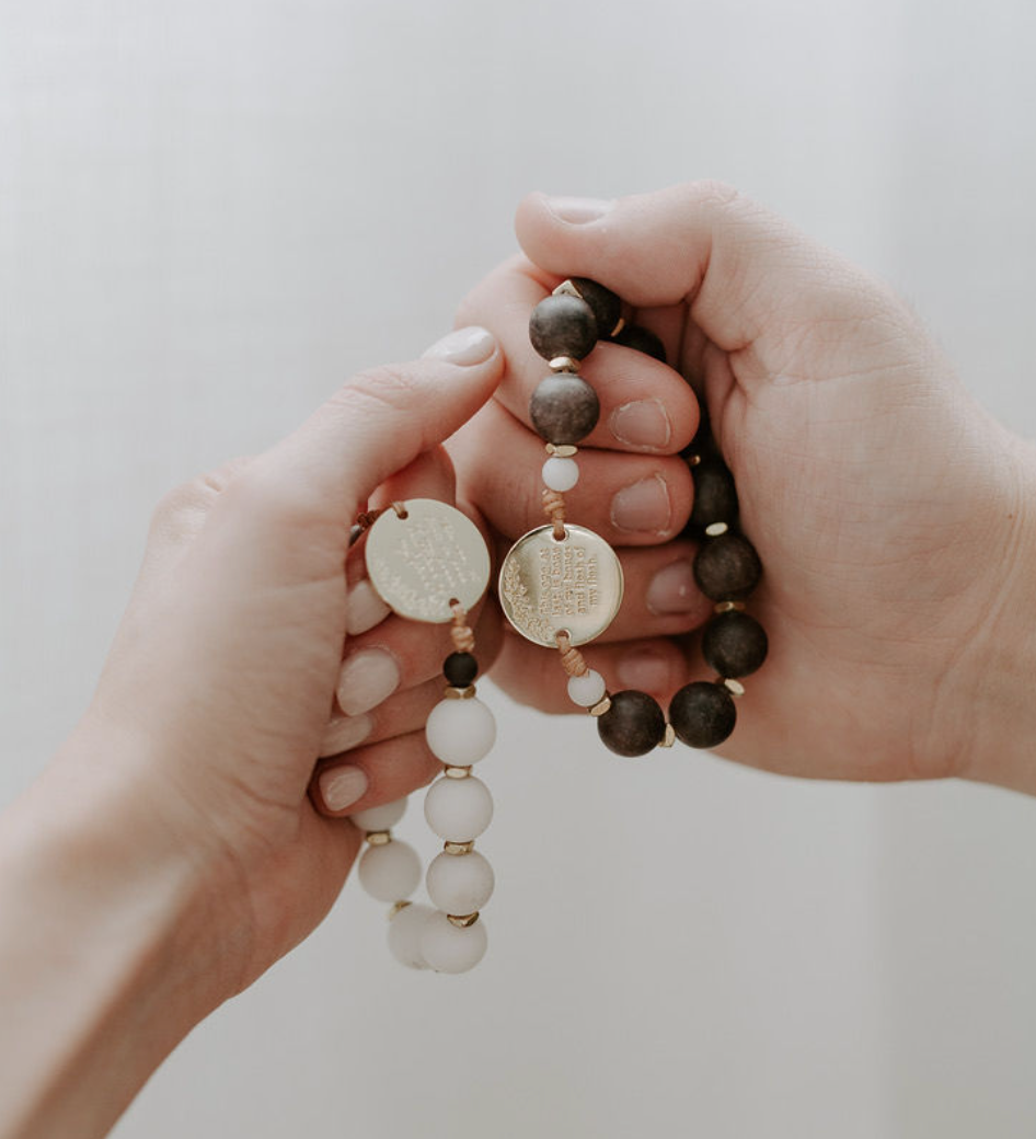 hands praying the eden set rosary