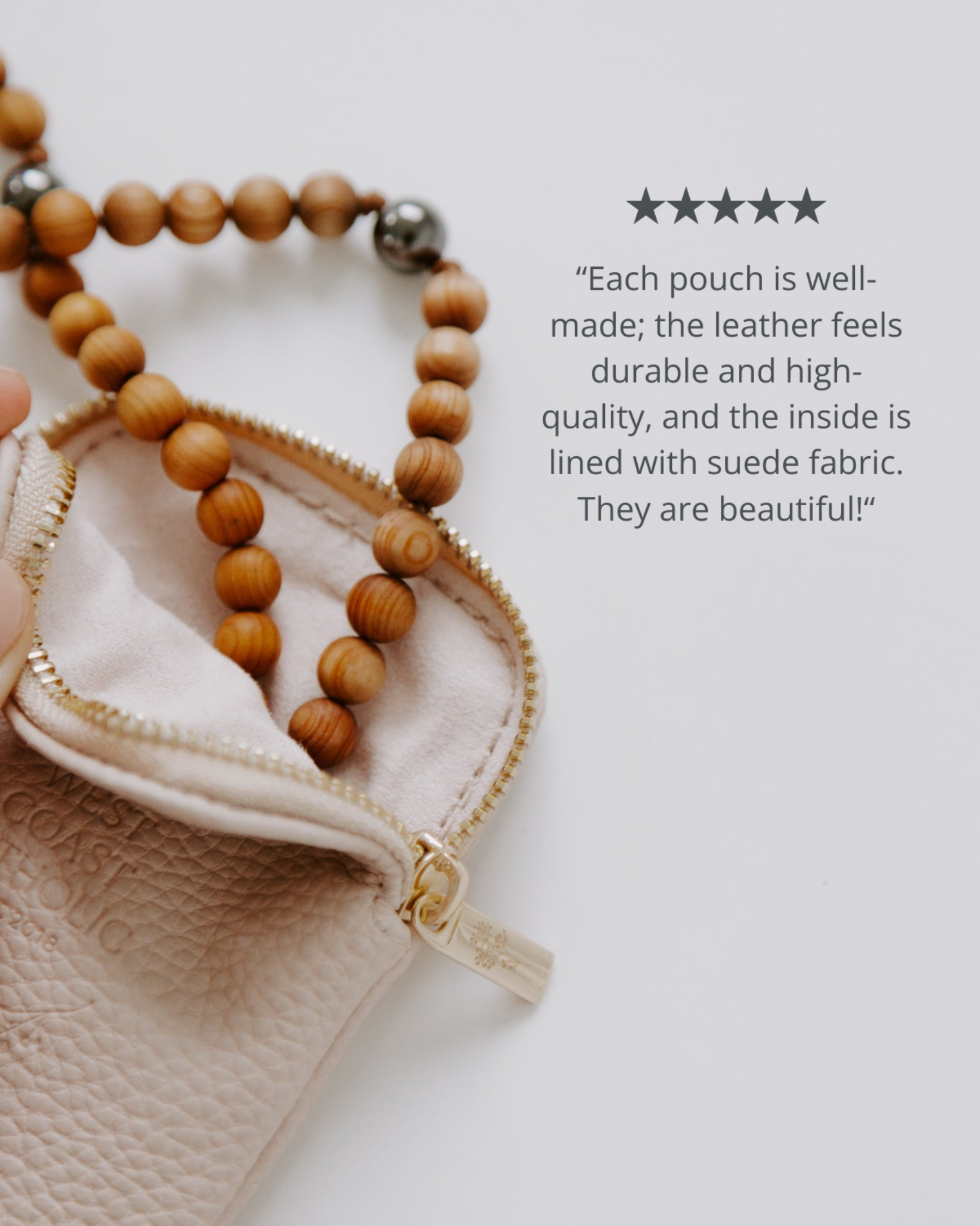 Leather pouch with wooden beads on a white background