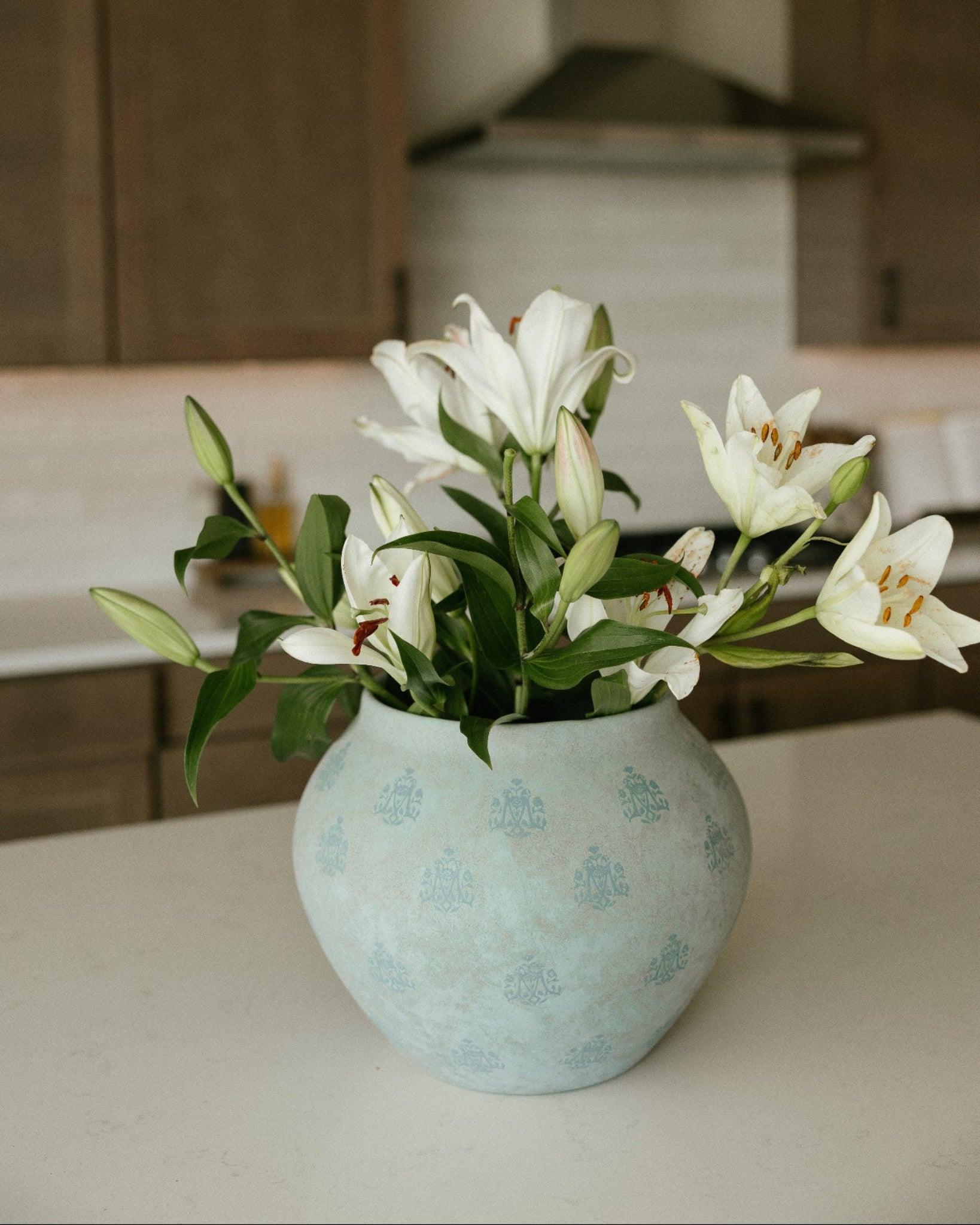 A styled Marian Vase by West Coast Catholic in a beautiful modern kitchen. 