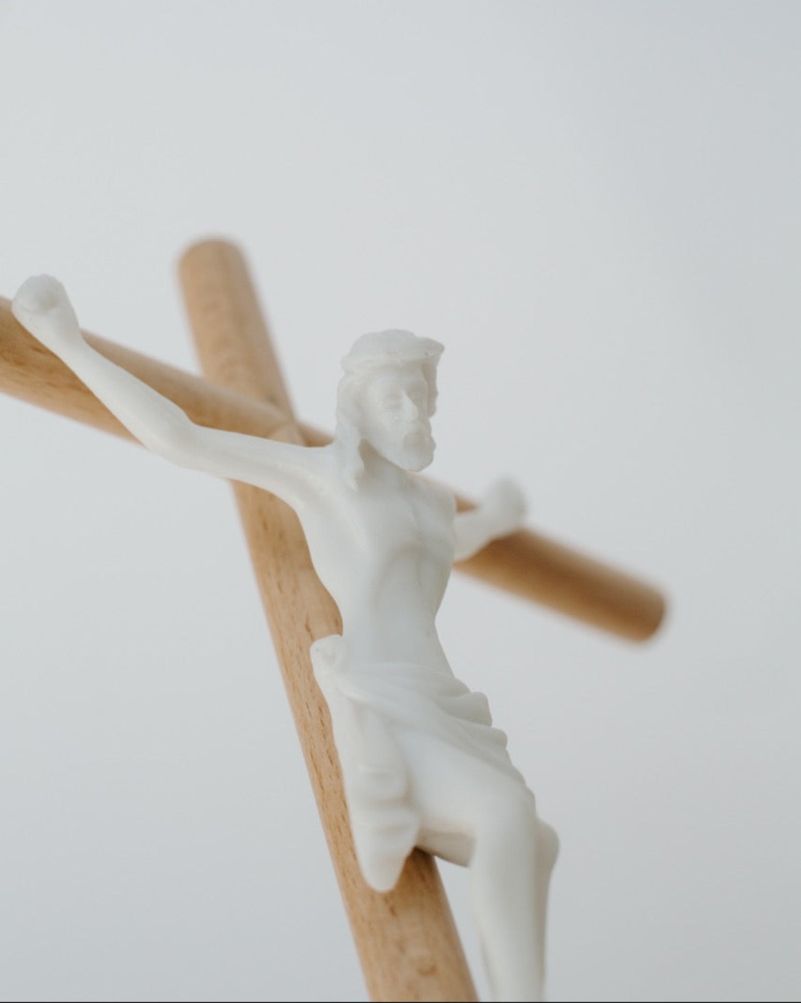 Detail shot of modern wall crucifix on white background