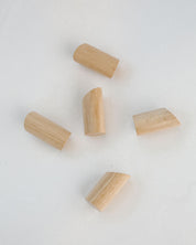 Five wooden rosary pegs on a white background