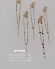 Set of wooden pegs on wall 
with a neutral background