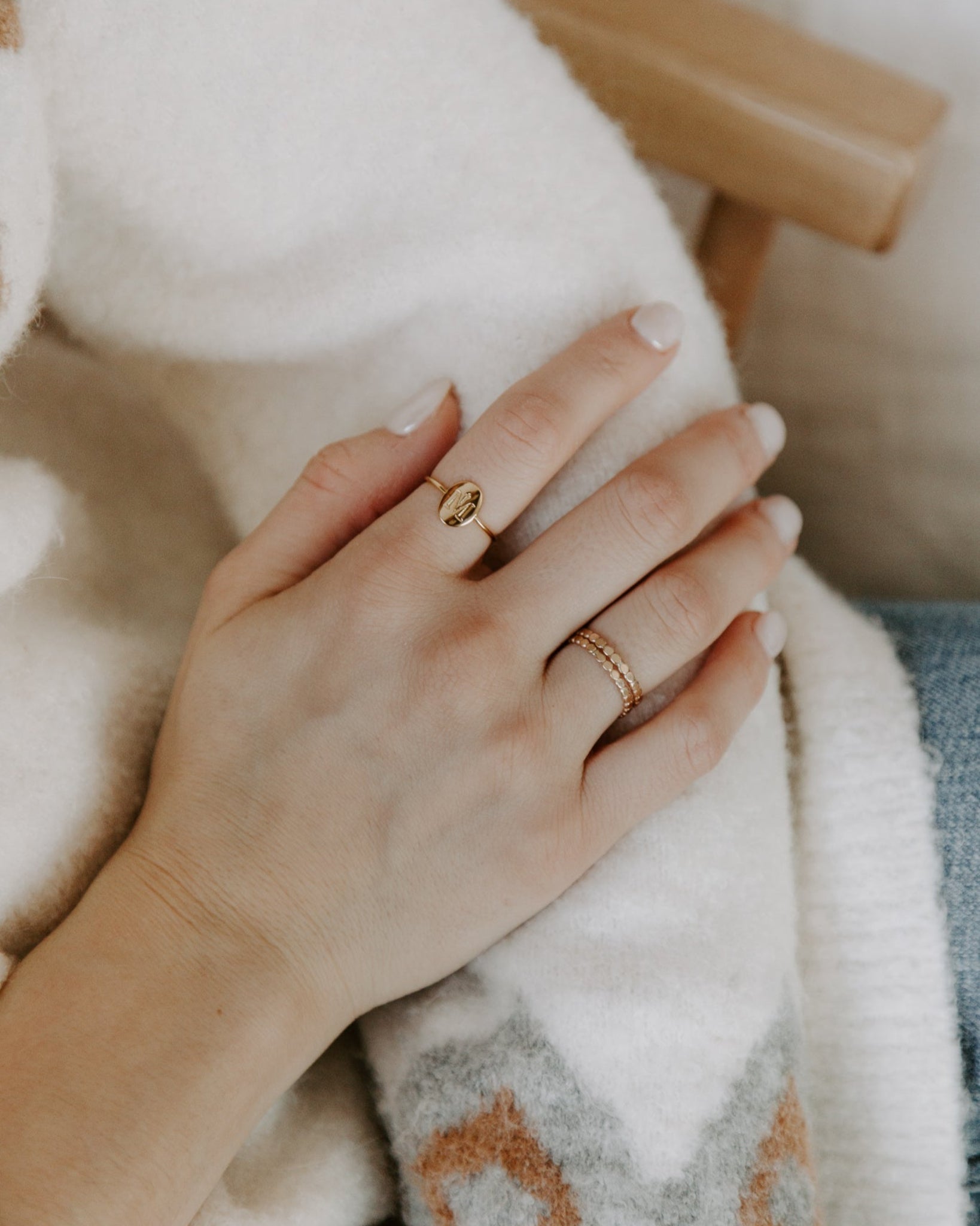 Gold Marian Consecration Ring styled on a woman's hand