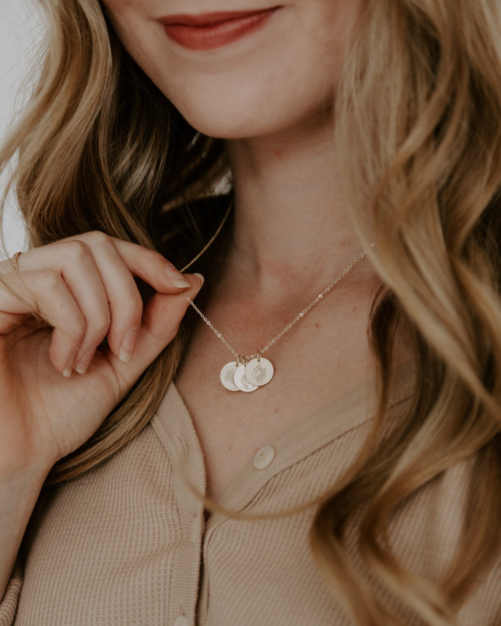 Gold Heavenly Hearts Necklace styled on a womanGold Heavenly Hearts Necklace styled on a woman
