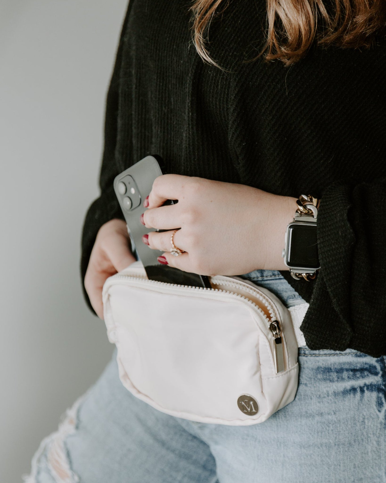 Cream Marian Belt Bag Styled On Woman and Showing Functional Use